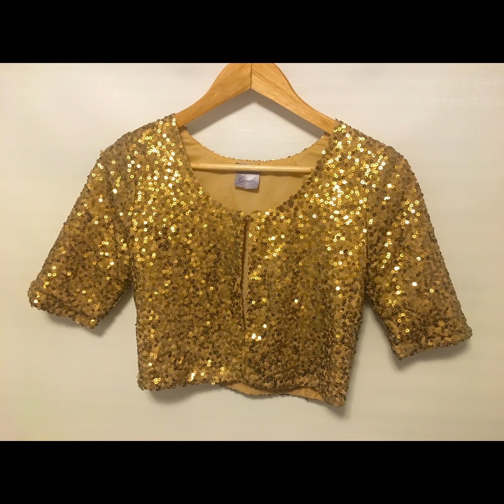Fun gold sequinned cropped bed jacket.